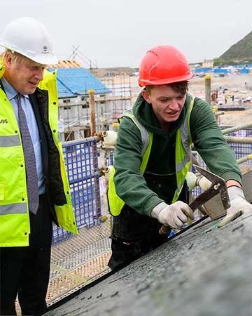 Boris Johnson tries roof slating