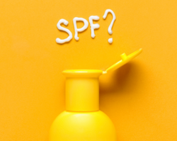 Yellow bottle with SPF written in white cream 