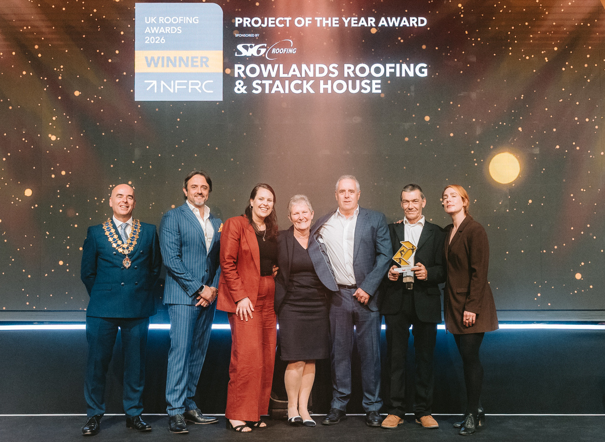 The team collecting their Project of the Year trophy
